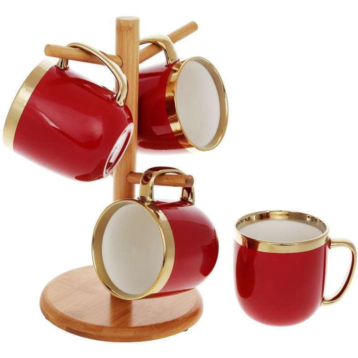 Four matte mugs in pink and terracotta hanging on a metal stand